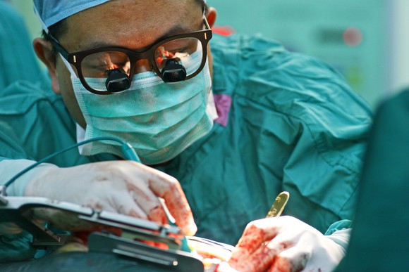 Surgeon performing an operation
