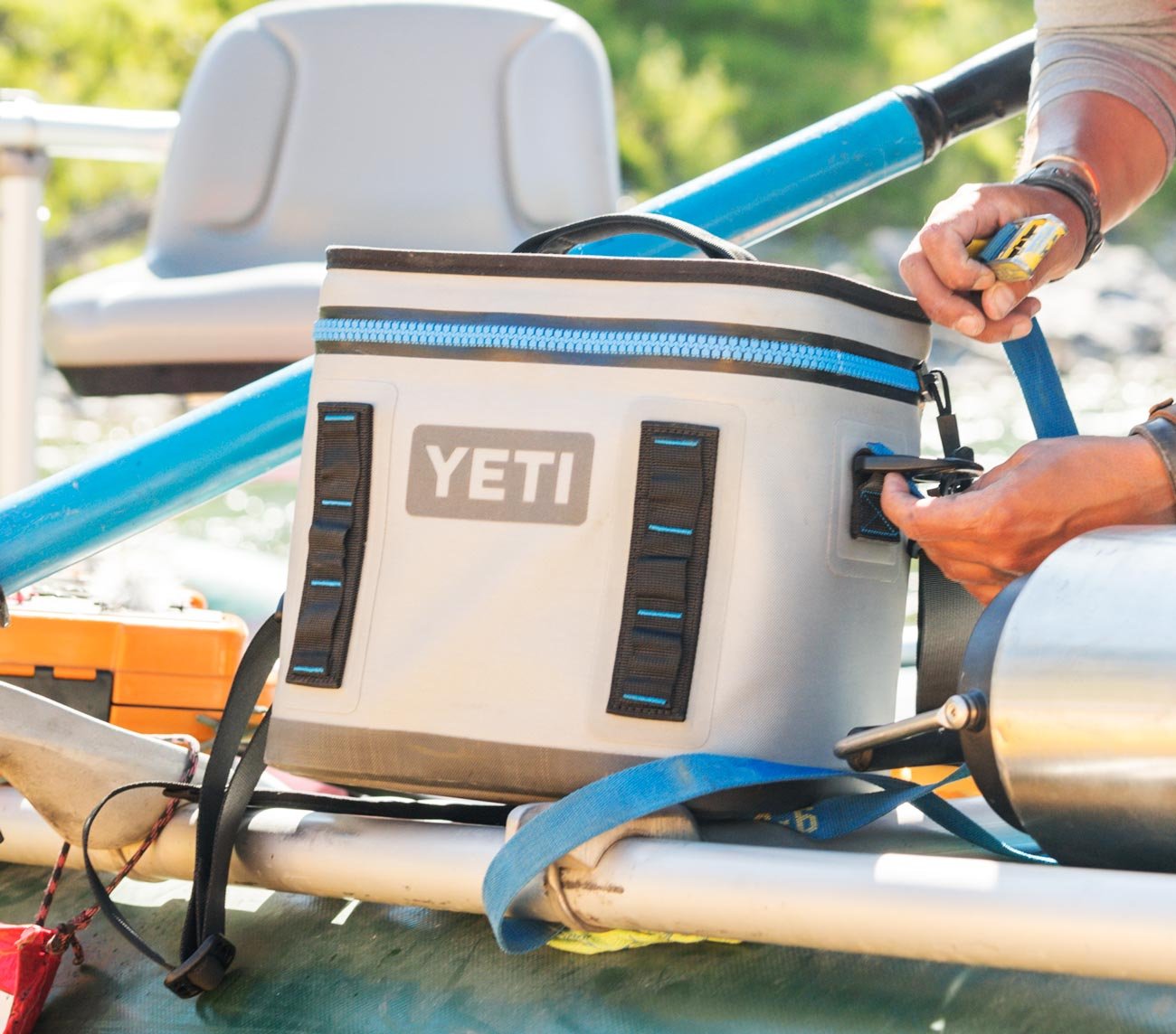 Man strapping in a Yeti cooler
