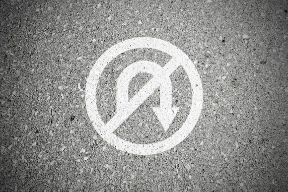 A no turnaround sign drawn on the pavement.