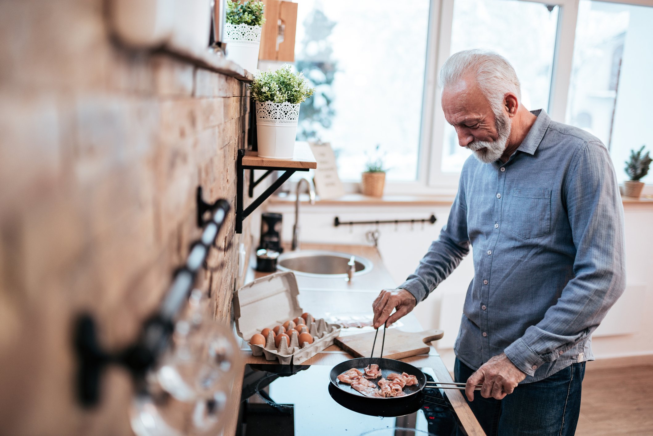 Older man cooking