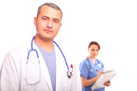 Doctor and nurse looking forward at the viewer