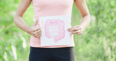 woman holding picture with a smiling colon