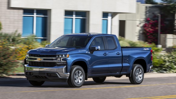 A blue 2019 Chevrolet Silverado pickup in "crew-cab" configuration, with four doors and a back seat.