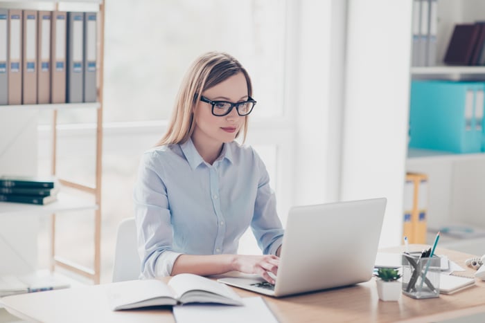 Woman typing on laptop