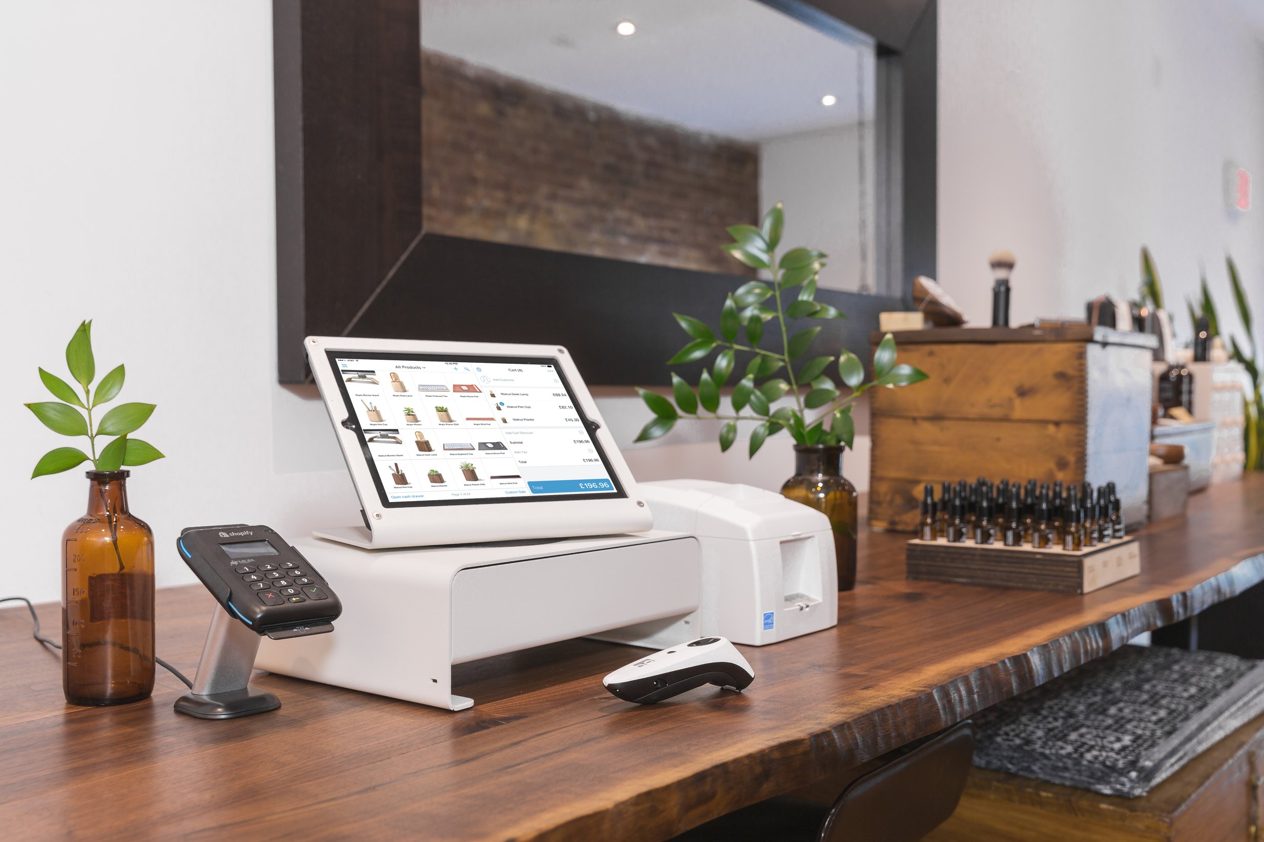 The Shopify point-of-sale system on the counter of a small boutique store.