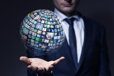 Businessman with globe full of images
