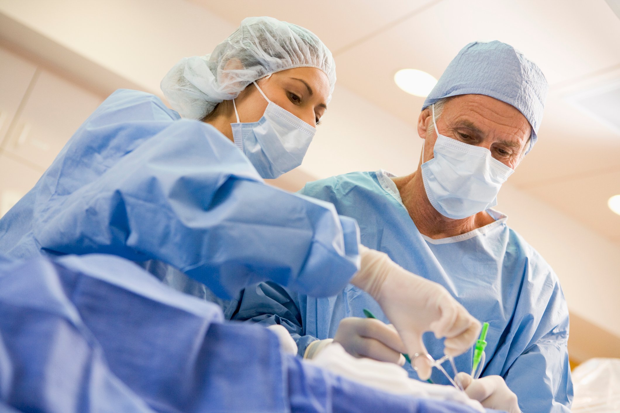 Doctors with scrubs on performing surgery