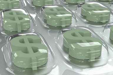 pills shaped as dollar signs in packaging