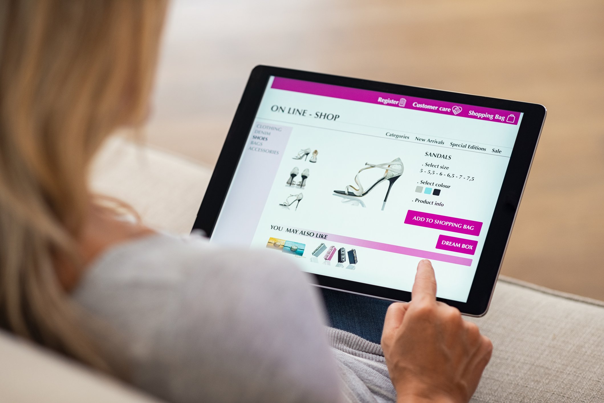 Woman using a tablet to shop for shoes online
