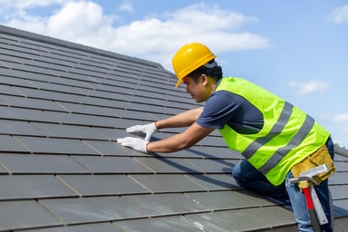 Worker Installing Roof Products