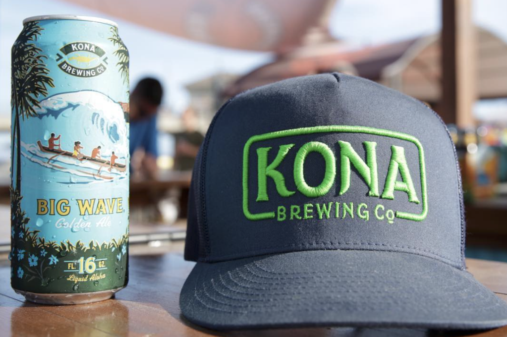 Can of Kona beer and trucker hat