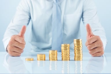 Growth Stock Gold Coin Stack Thumbs Up Getty