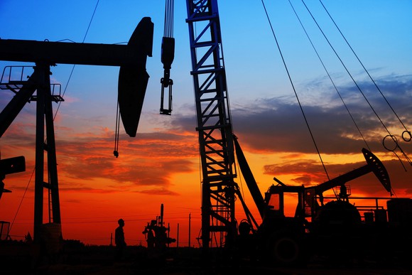 An oil field at dusk.