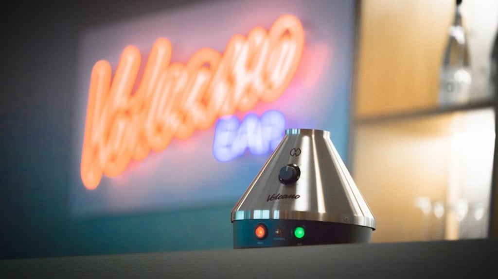 The Volcano tabletop vaporizer on a bar rail.