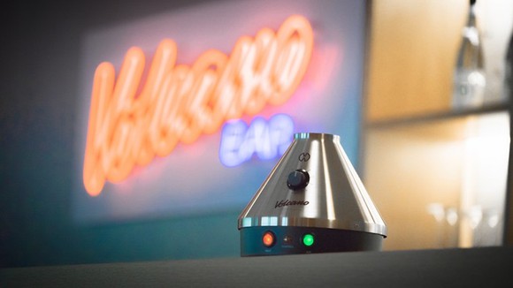 The Volcano tabletop vaporizer on a bar rail.