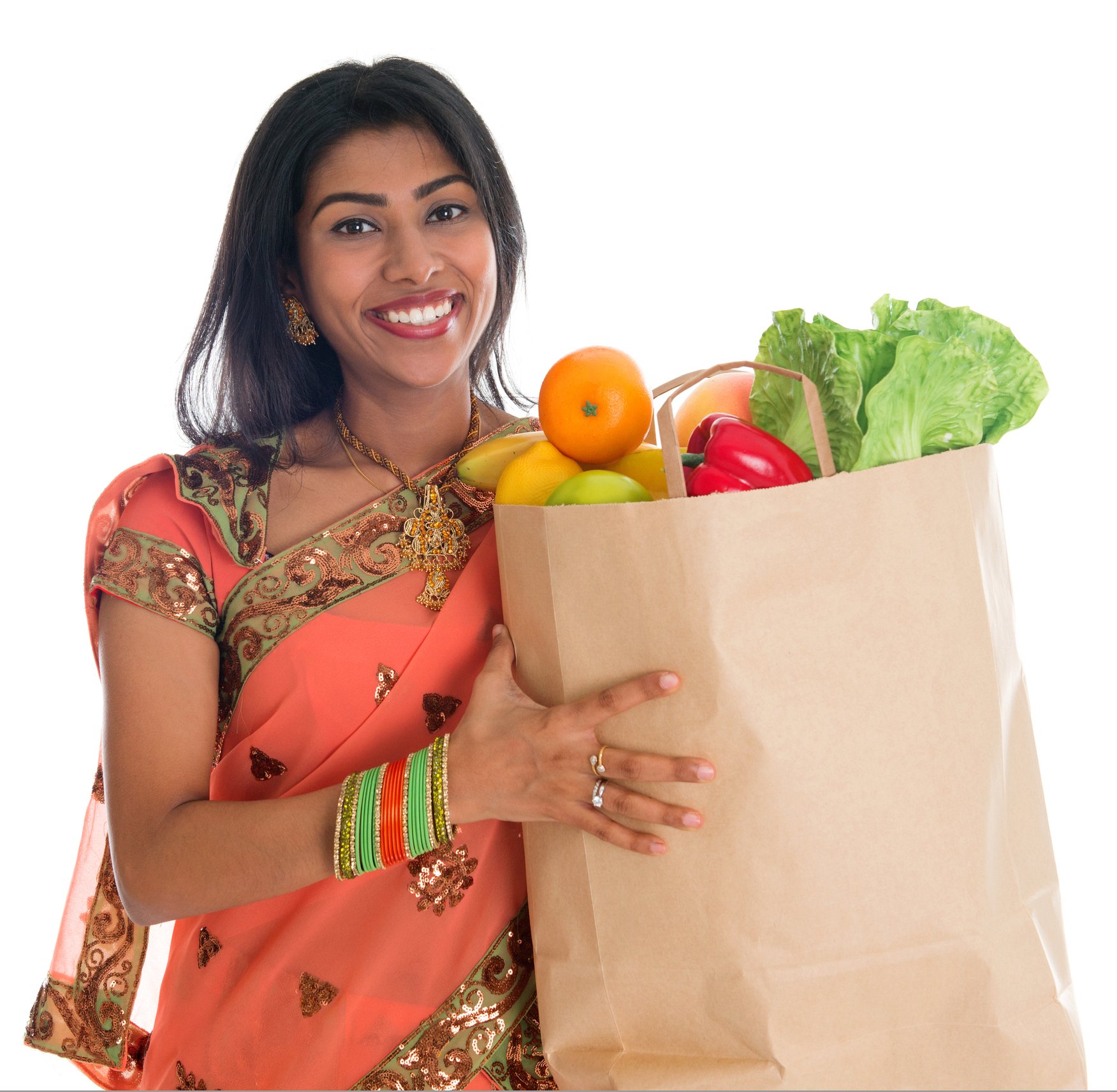 A woman from India holds a grocery bag. Getty image