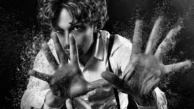 Black and white photo of magician casting a spell