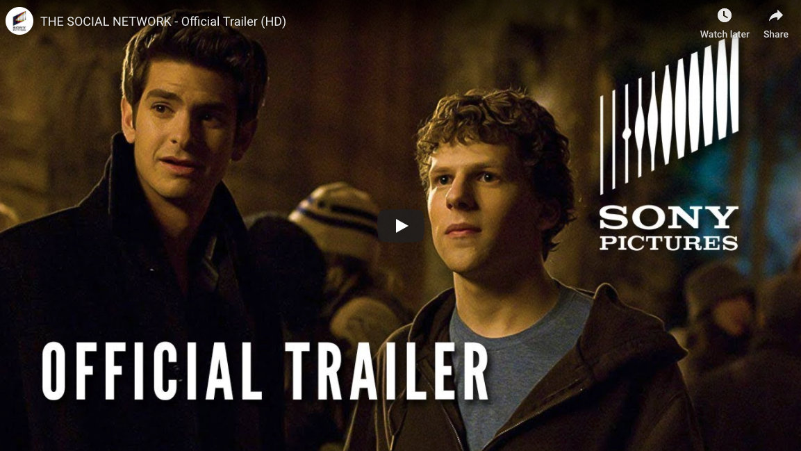 A photo of actors Andrew Garfield and Jesse Eisenberg in a screenshot of the official trailer for the 2010 movie The Social Network.
