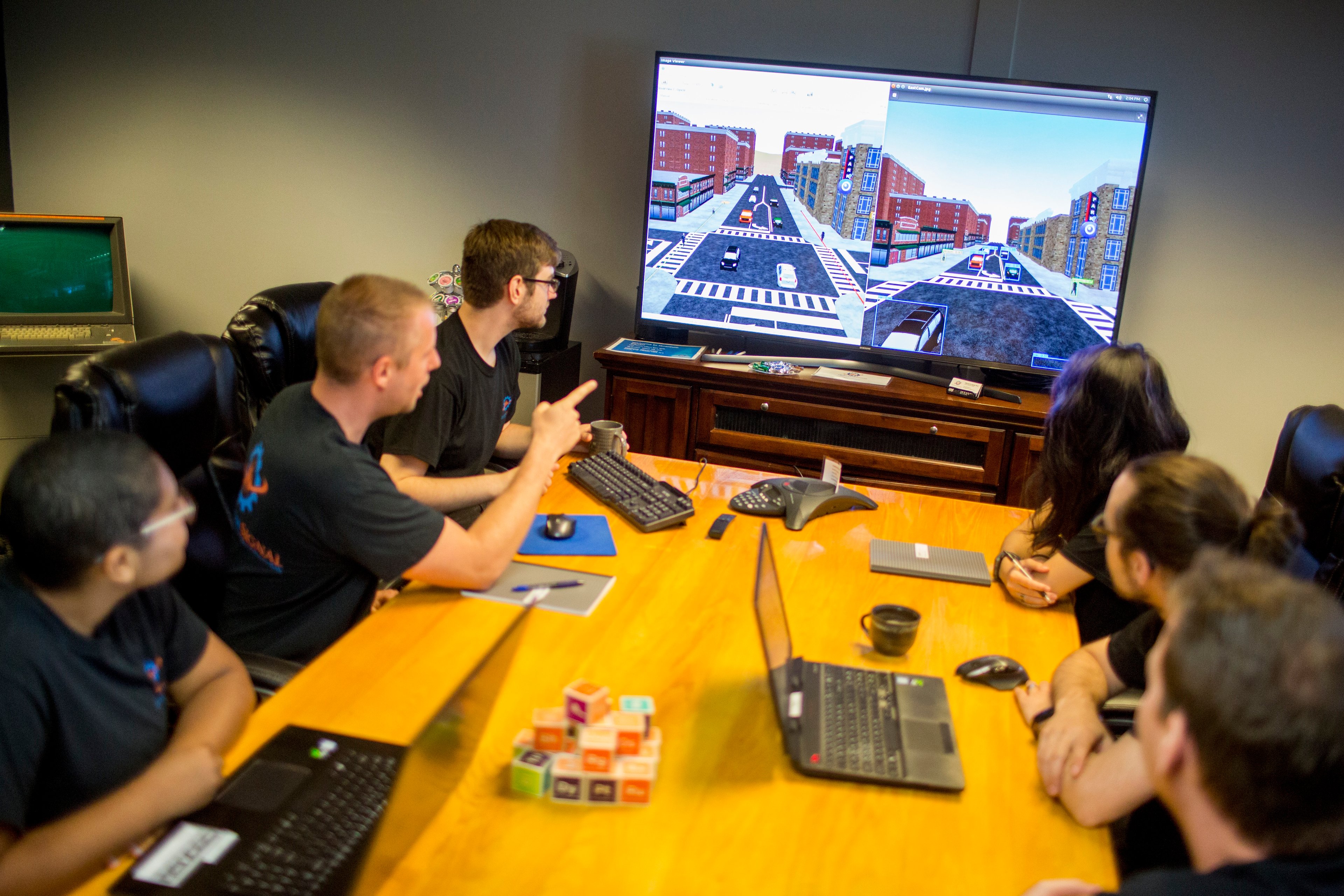A driverless tech team in a meeting.