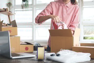 Small Business Entrepreneur Packing Chuck Taylors