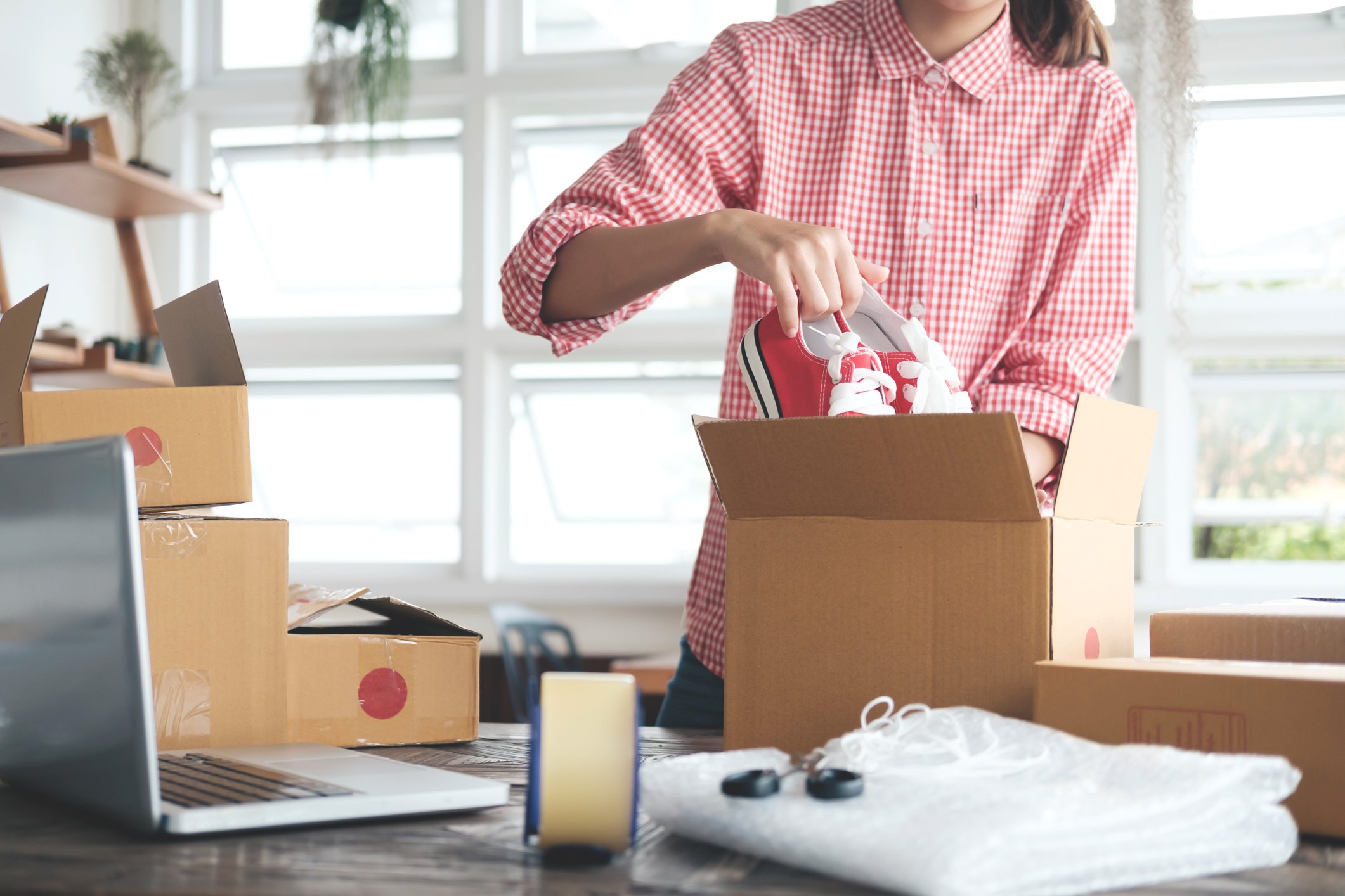 Small Business Entrepreneur Packing Chuck Taylors