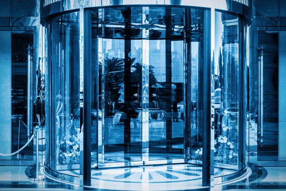 View from outside of a building's glass revolving doors.