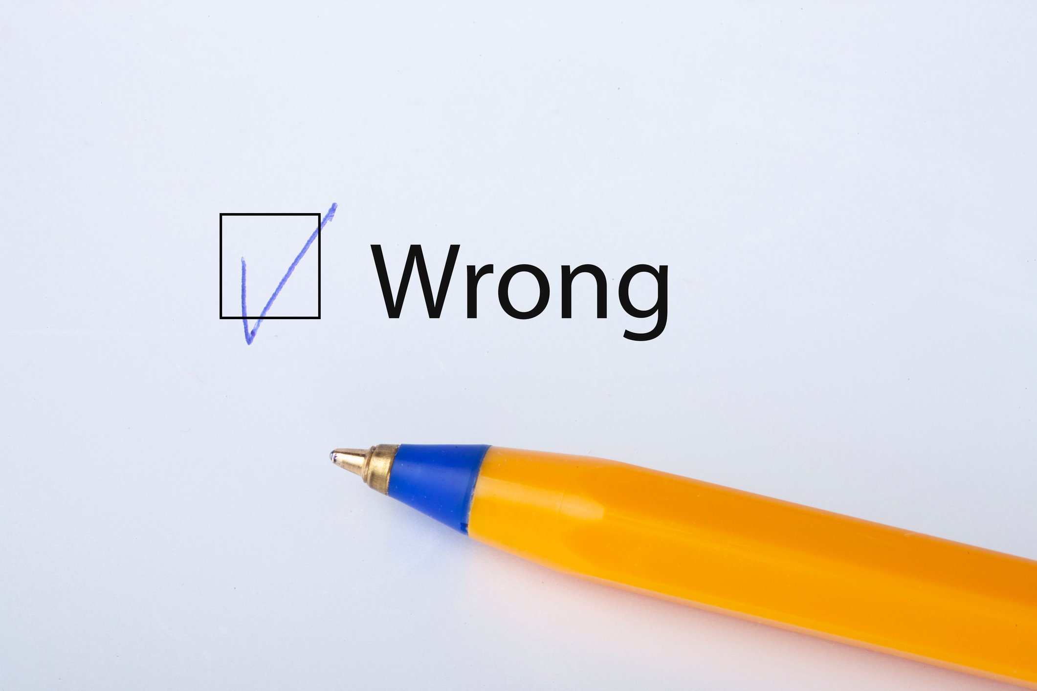 A pen next to the word Wrong with a checked box next to it.