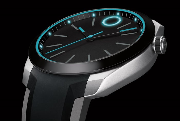 Modern watch with glowing blue indicators.