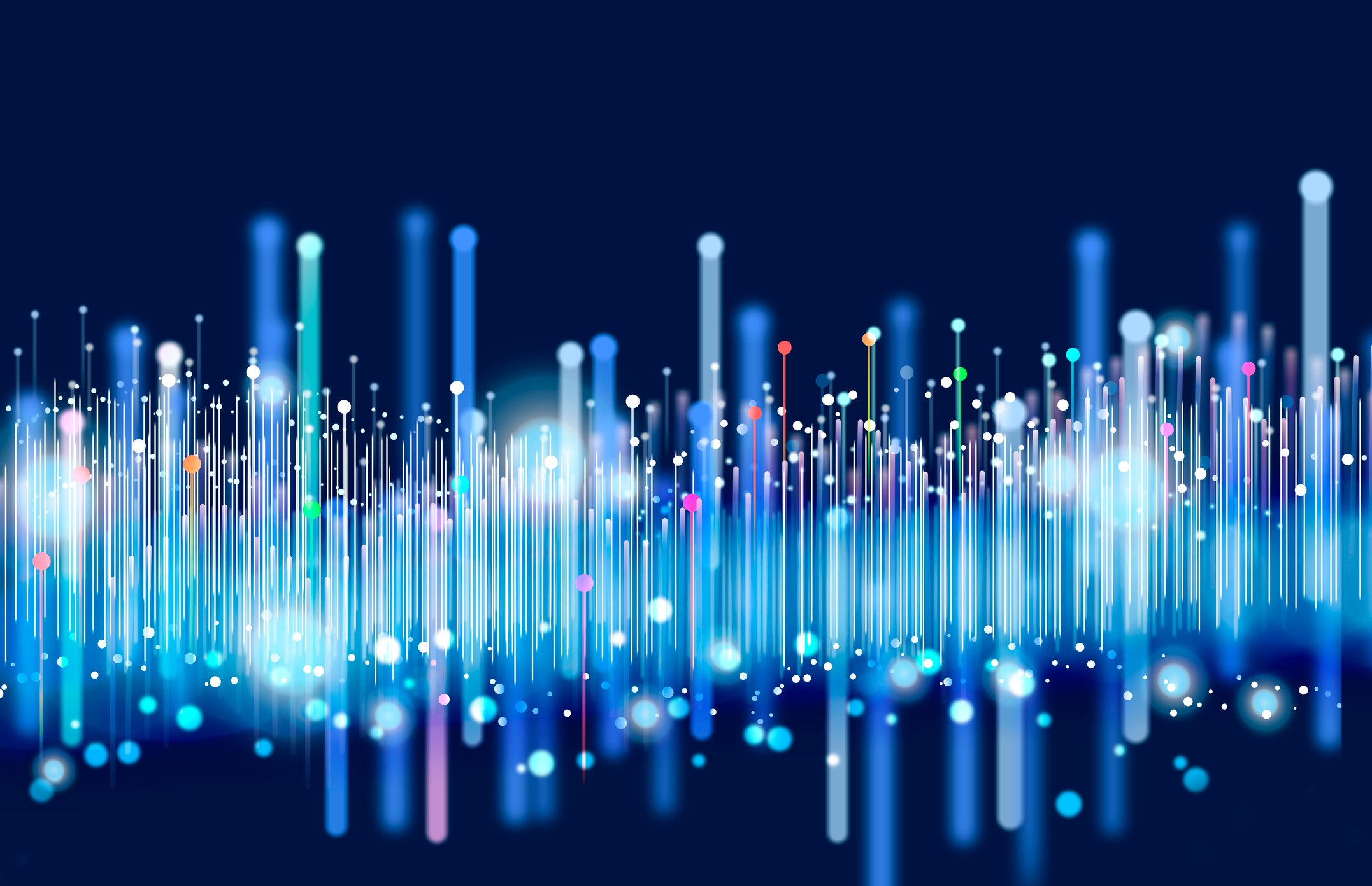 Colorful illuminated bright vertical lines on a black background symbolize big data transfer over a network.