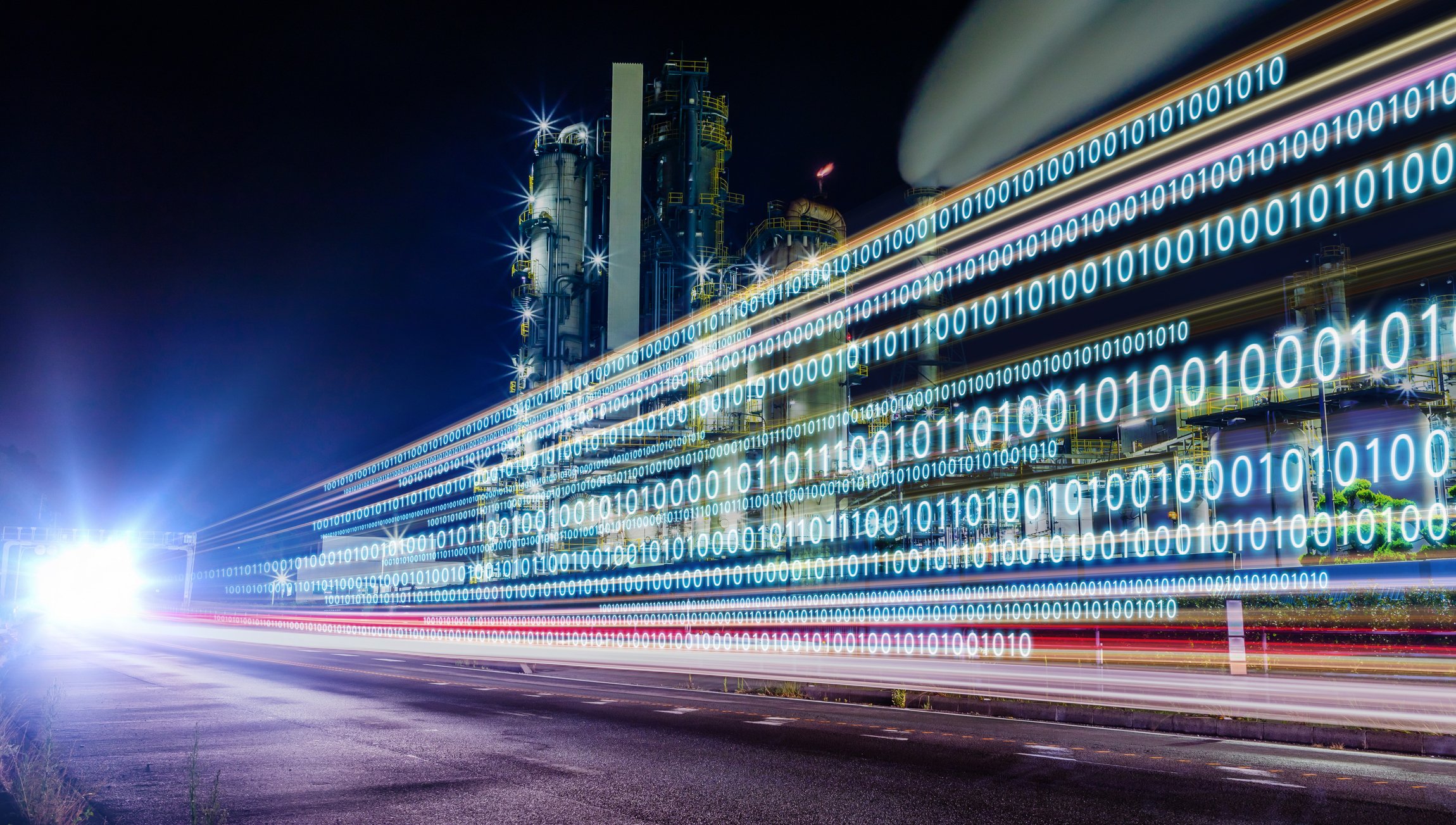 An industrial plant with zeros and ones overlaid on top (digital technology concept). 