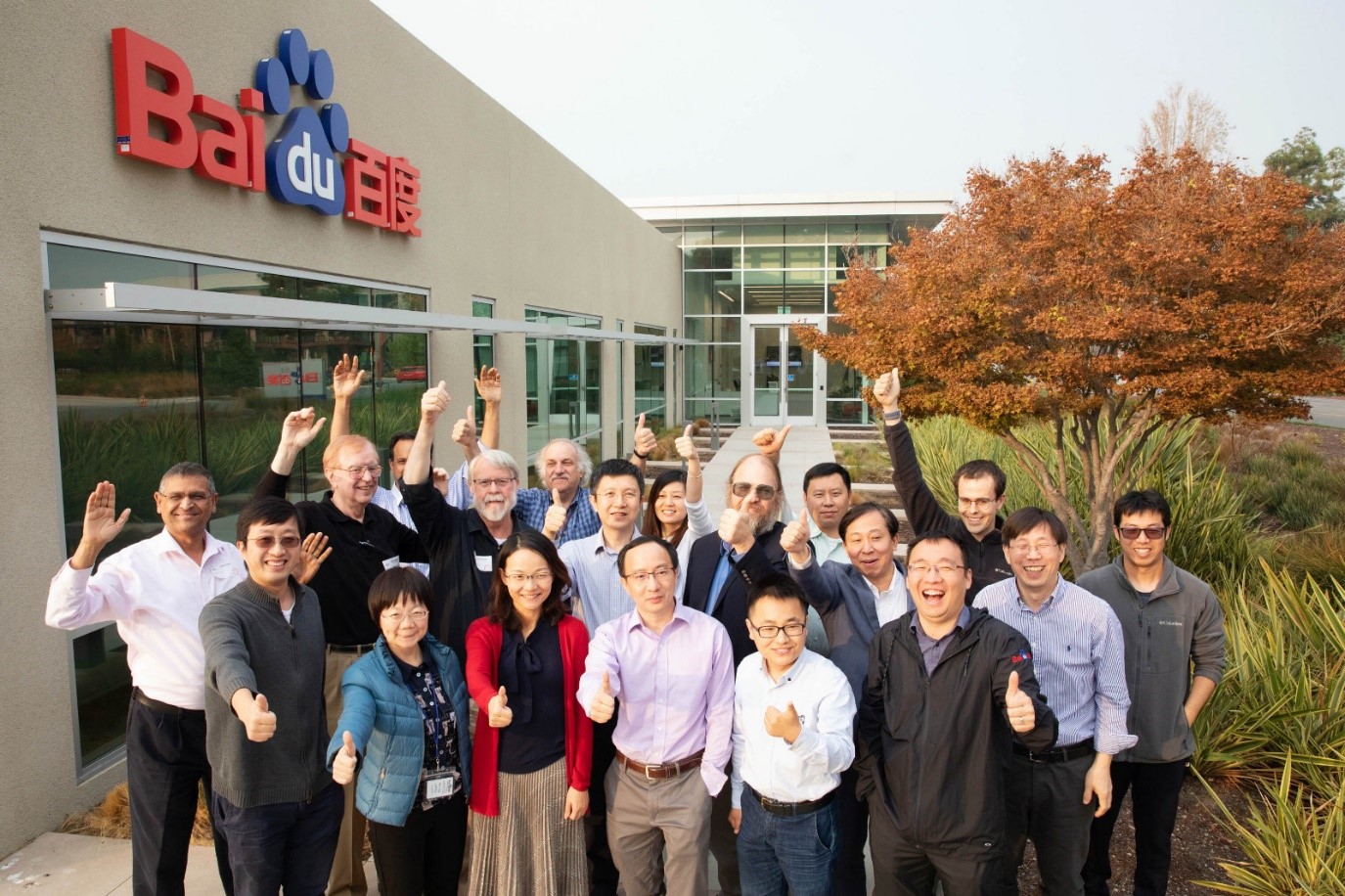 Baidu researchers celebrating in front of Baidu offices.