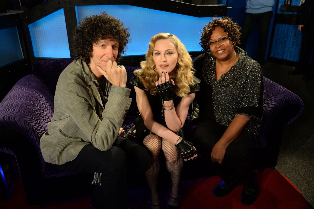 Howard Stern with co-host Robin Quivers on Sirius Radio's Howard 100 with Madonna on a couch after an interview.
