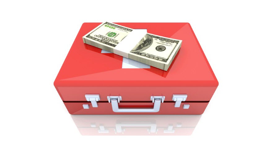 An aid box with cash on top