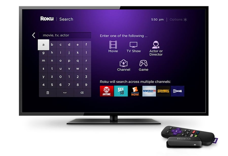 Roku streaming device next to a TV displaying the search section of the ROKU app.