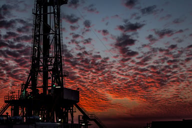 Drilling rig at sunset.
