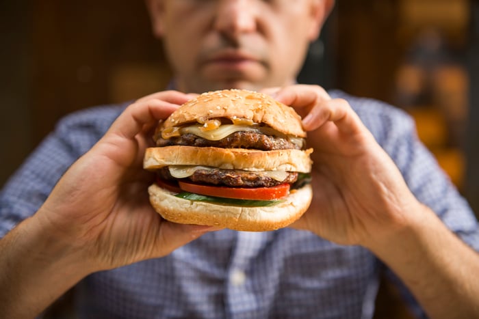 Man about to eat a burger