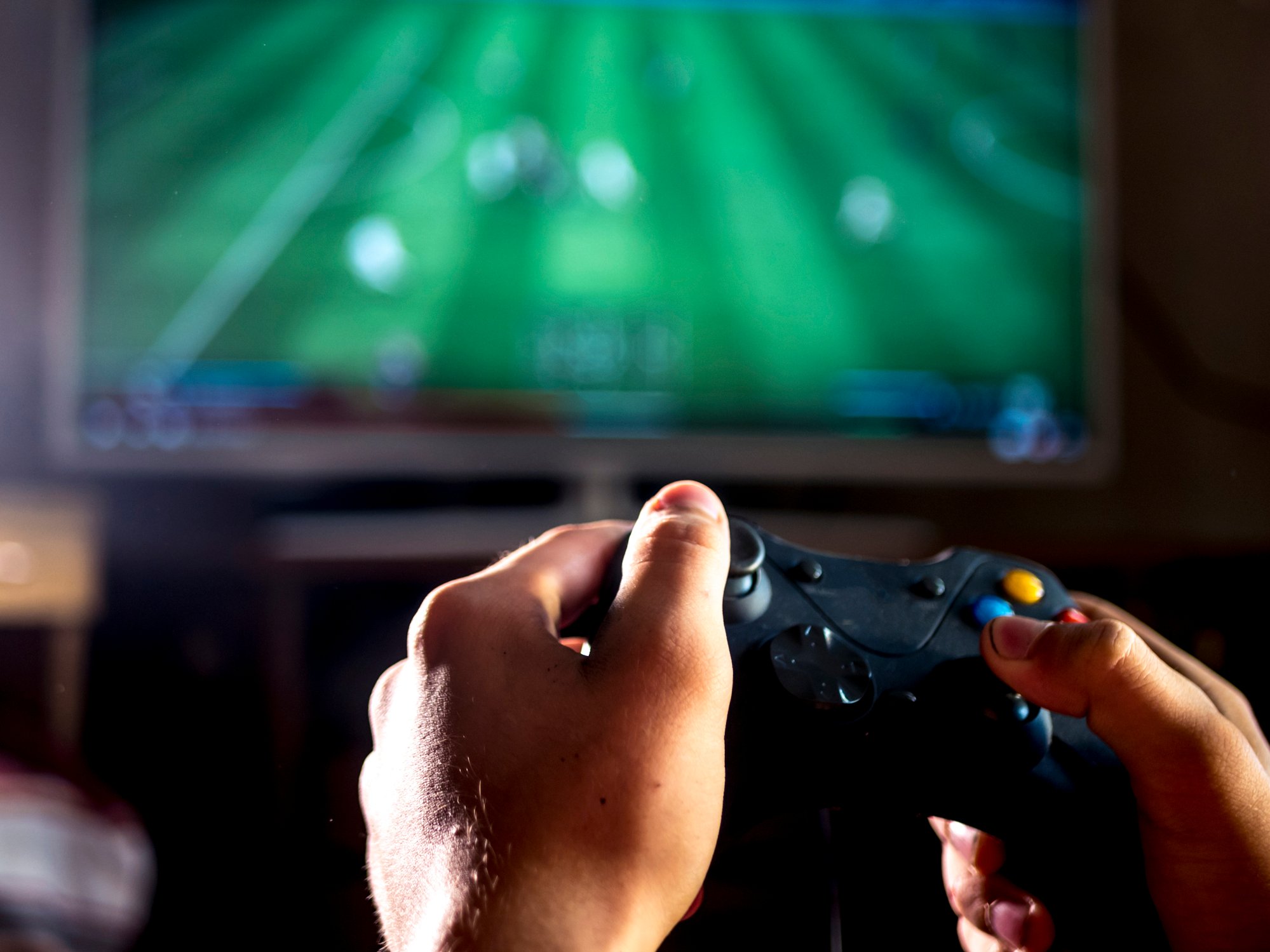 A person holding a game controller.