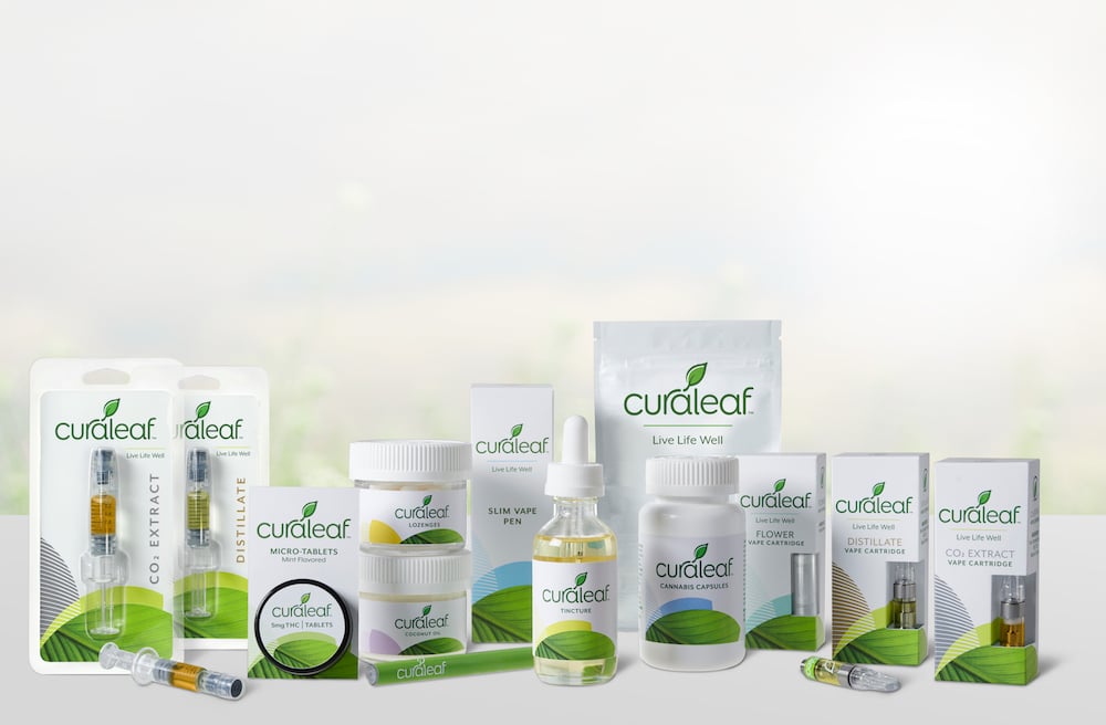 A set of Curaleaf products, including tablets.