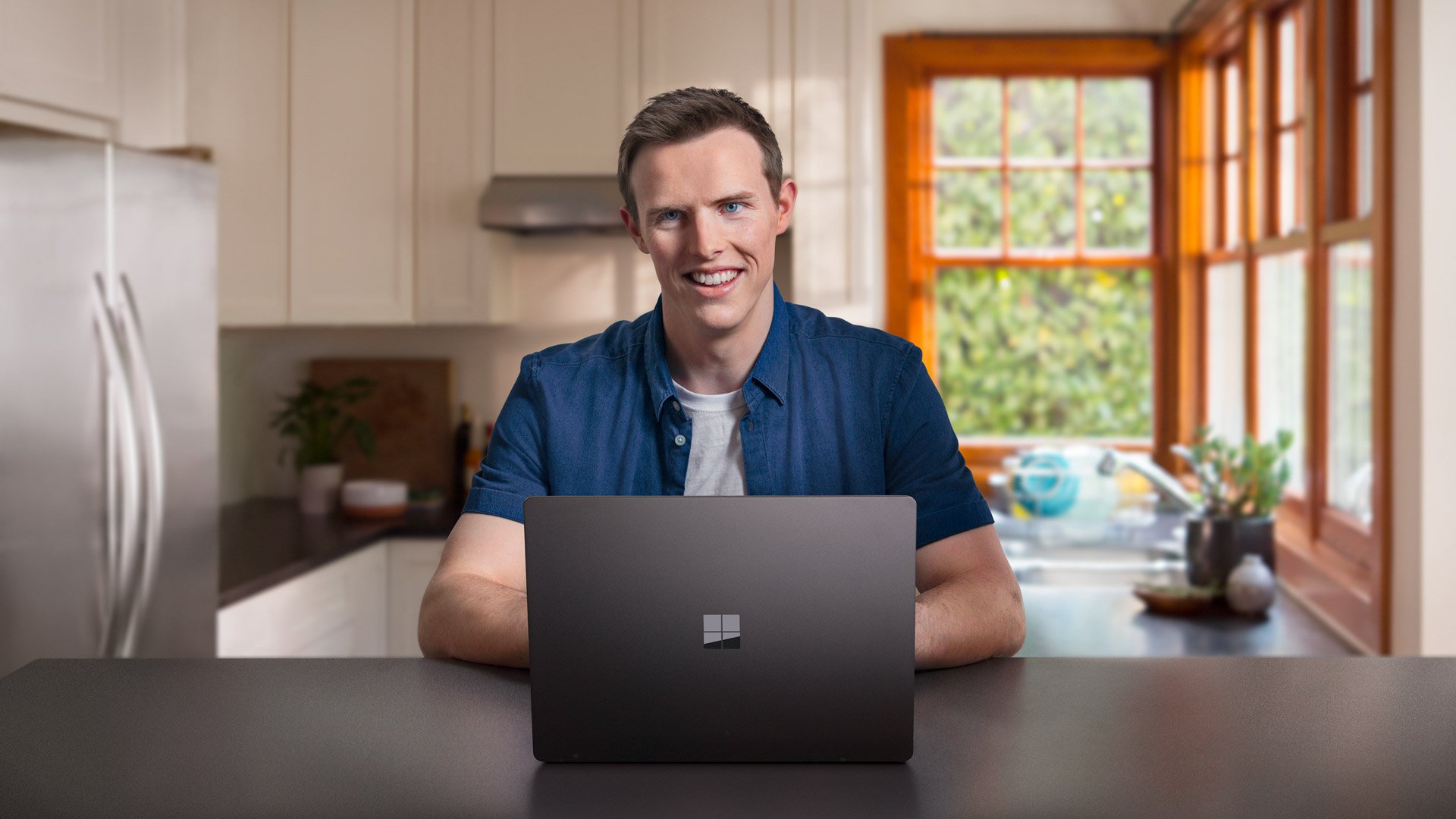 A man uses Microsoft's Surface Laptop 2.