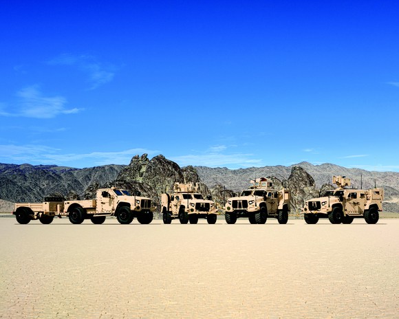 Family photo of four Oshkosh JLTV truck variants