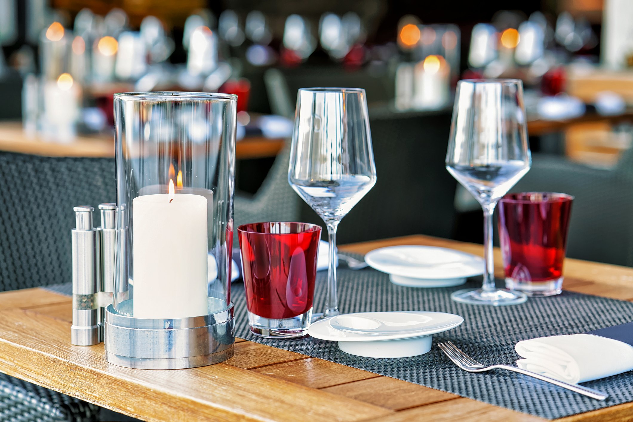 A table setting in an upscale terrace restaurant at a resort.