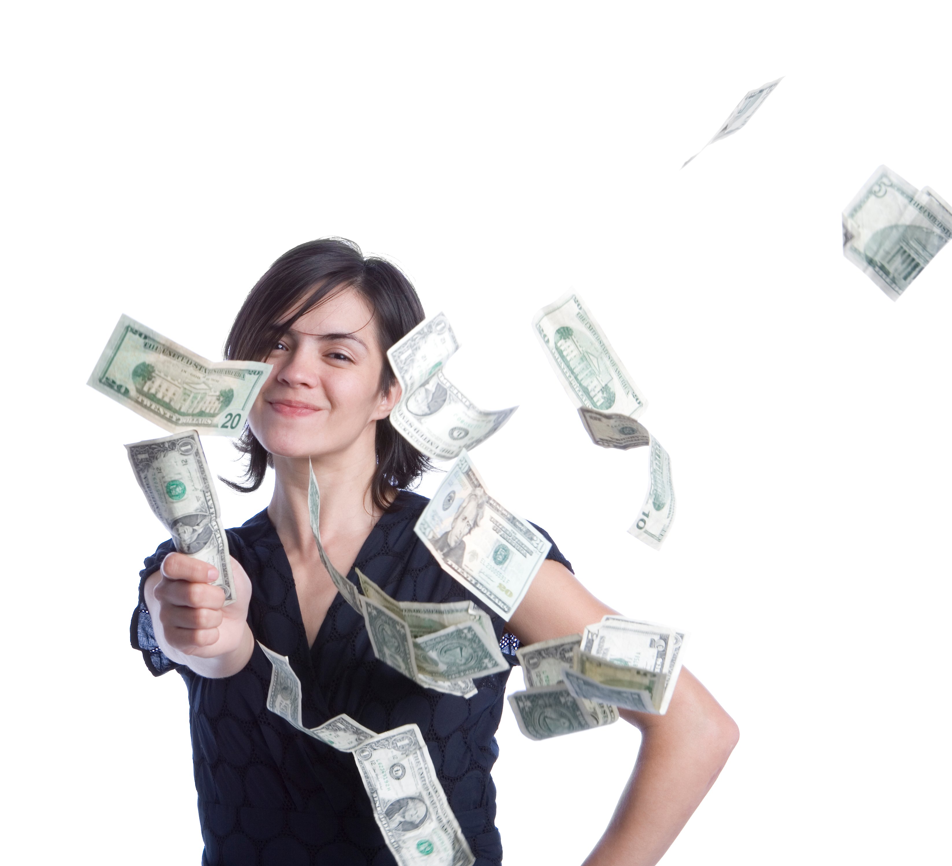 A young woman in a black T-shirt grabbing a dollar bill as other bills fly around her. 