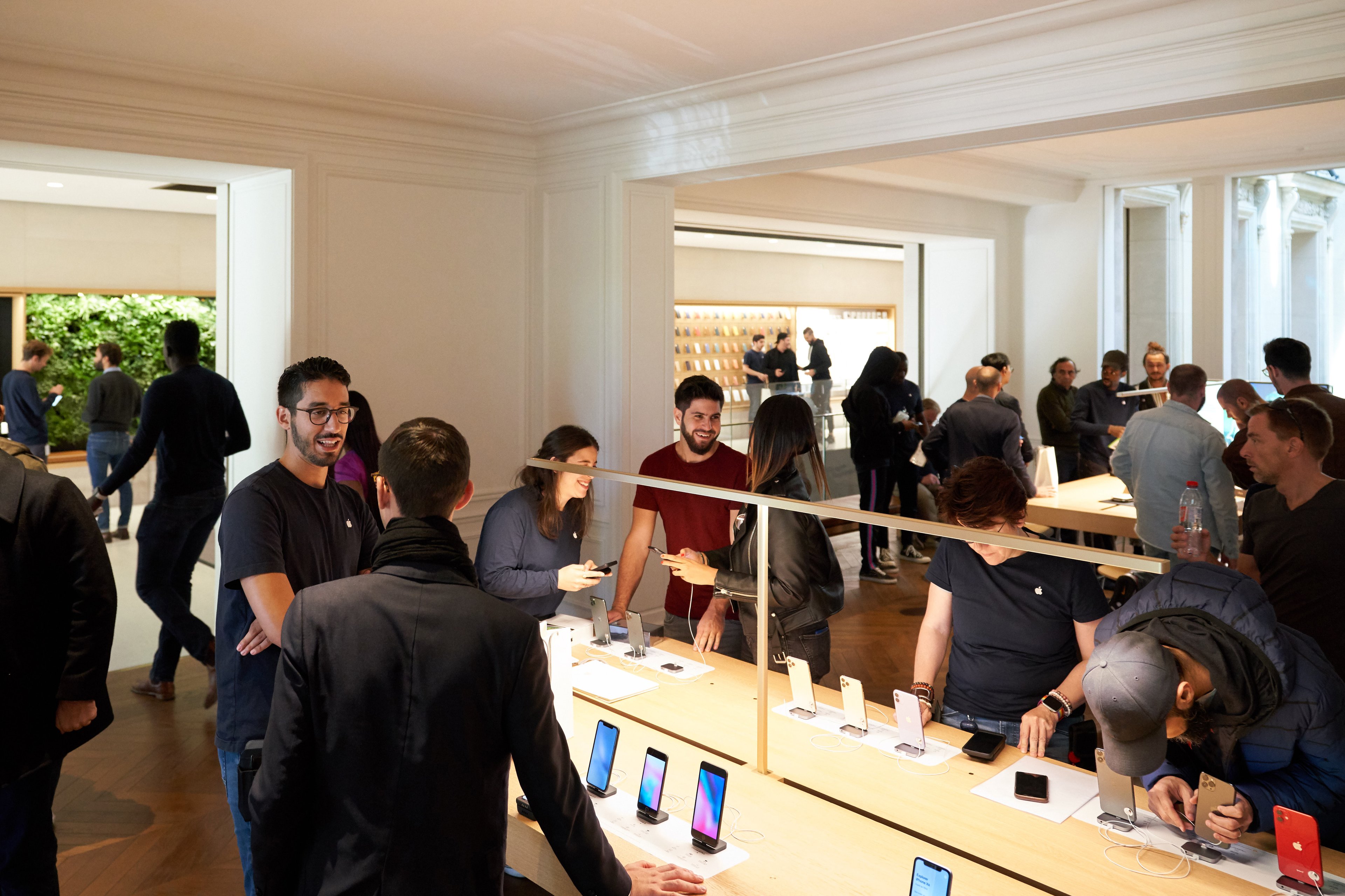 Customers shopping inside an Apple store
