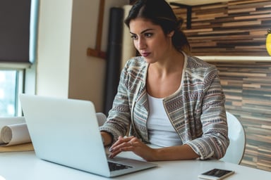 woman typing at laptop_GettyImages-624683932
