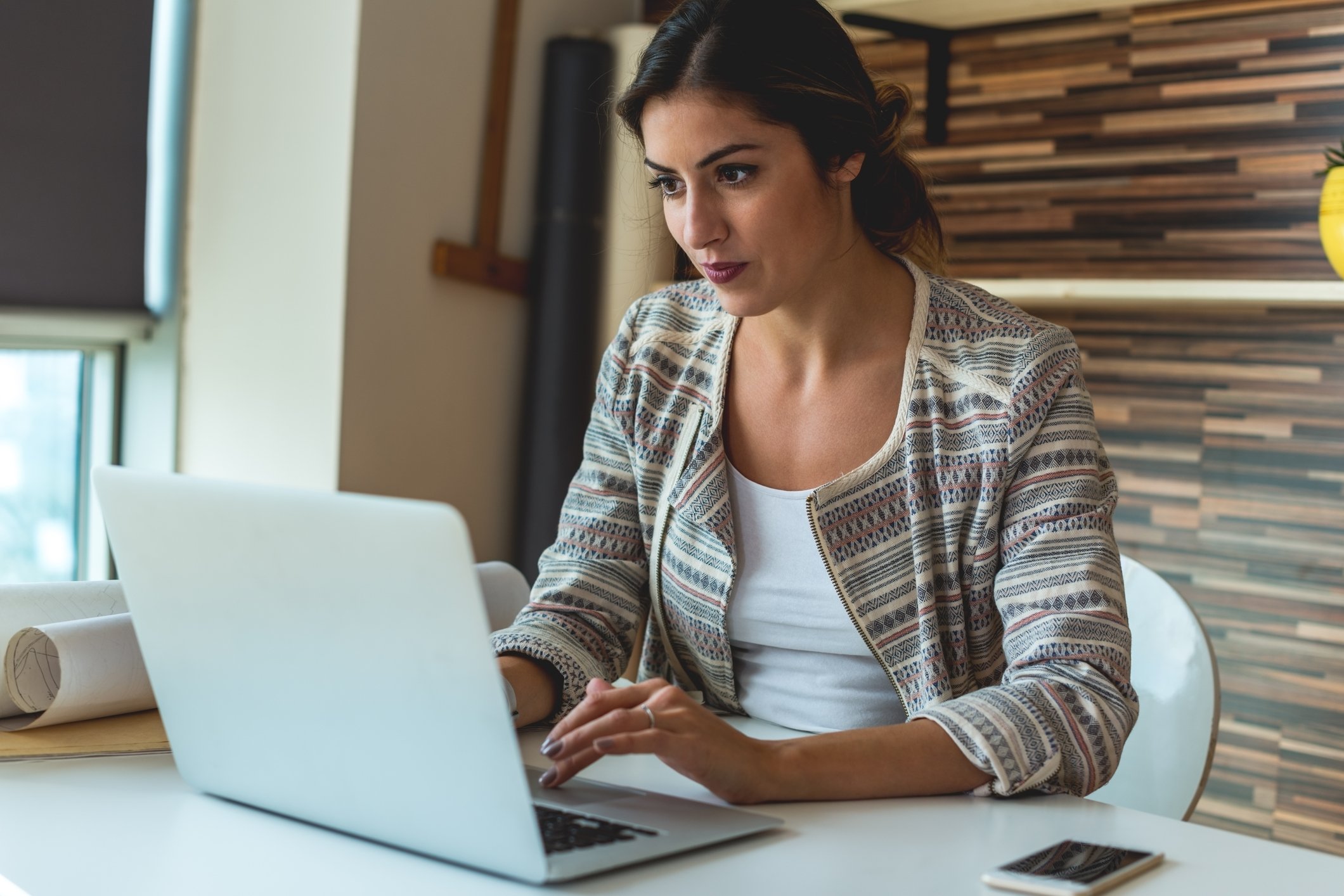 Woman typing on laptop