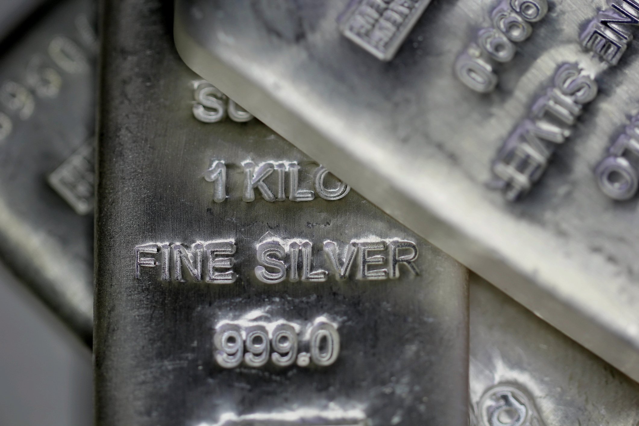 Kilo bars of silver stacked on top of each other.