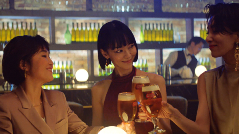 Three Asian women drinking beer