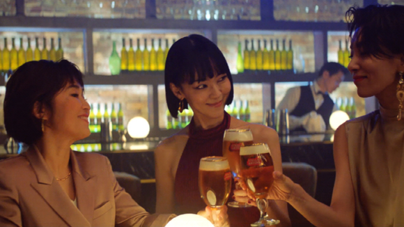 Three Asian women drinking beer