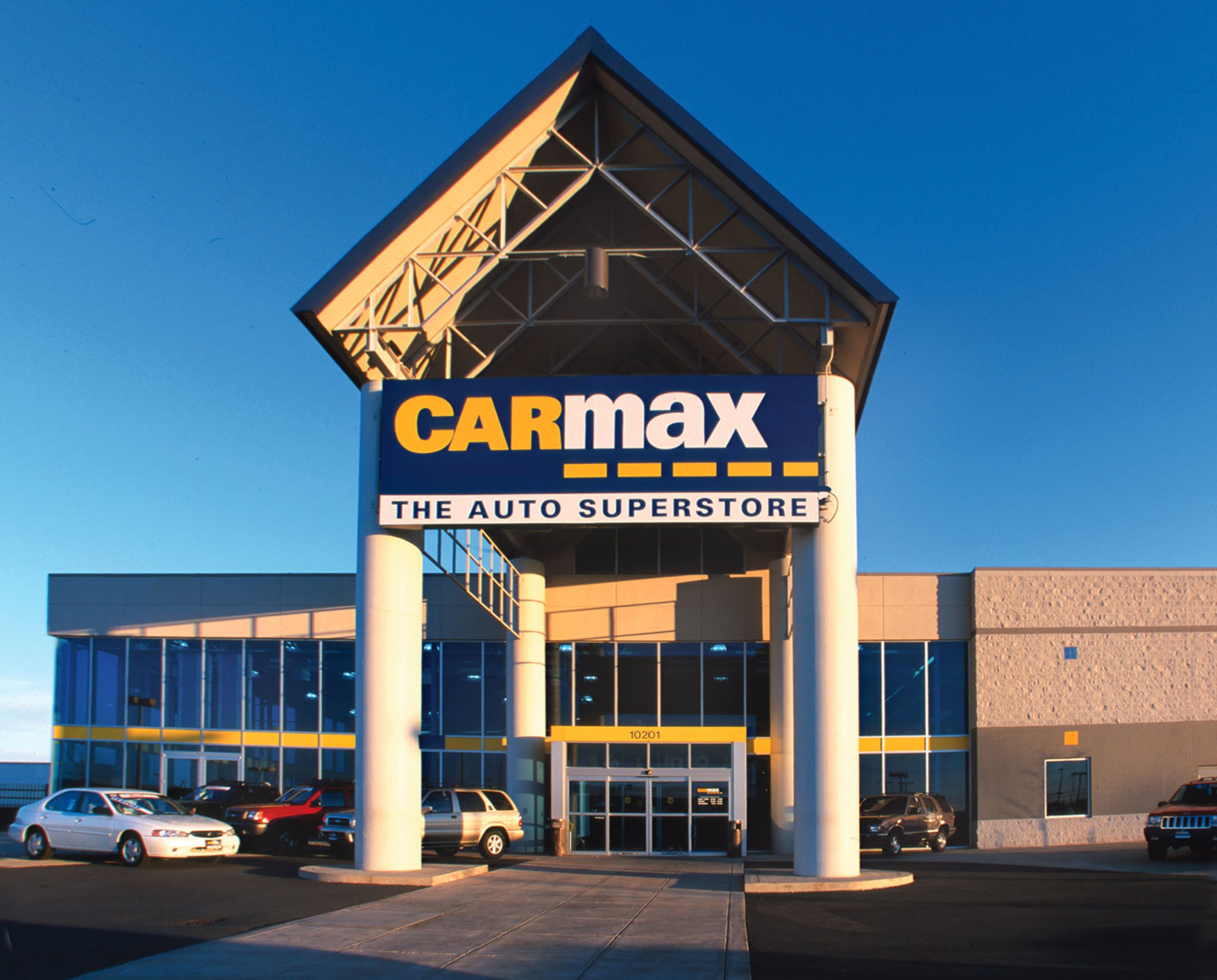 CarMax location with a few cars parked in front