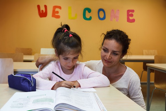 A teacher and a young student.